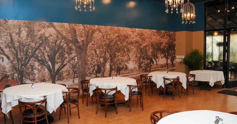 Interior, lined up dining tables ready for guests