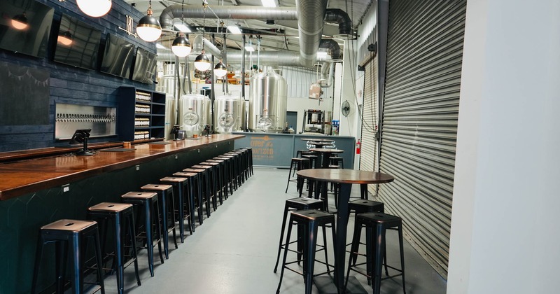 Bar area, tall tables and bar stools