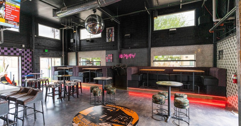 Seating and bar area, tv's on the wall and disco ball above