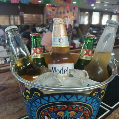Ice bucket with varuety of beer bottles.