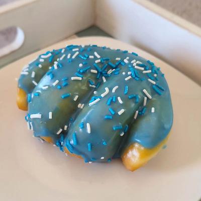 Wolf Paw shaped donut, with blue vanilla icing.