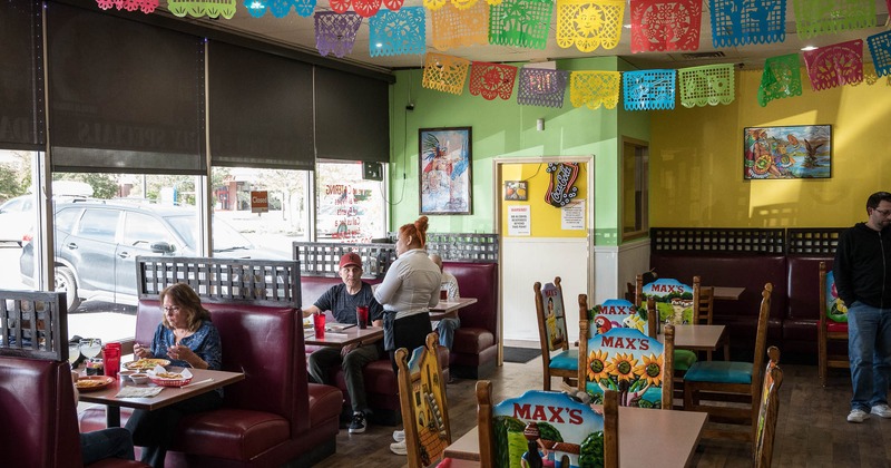 Interior, main dining area full of guests