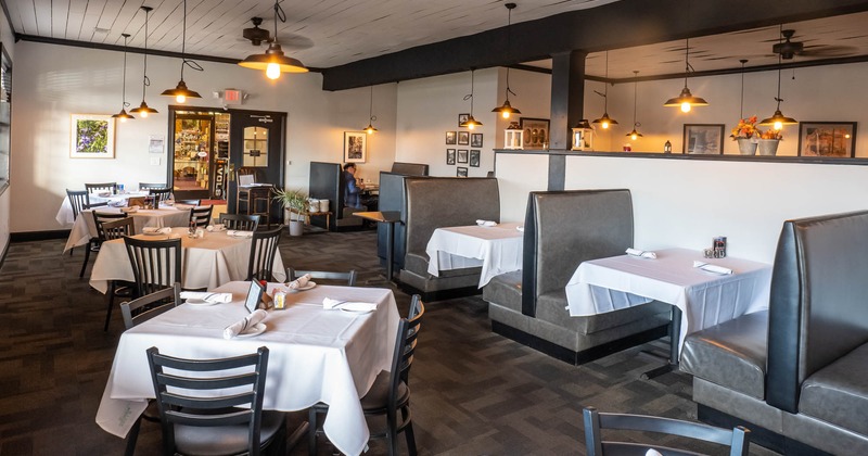 Interior, wide view of dining area and booth area