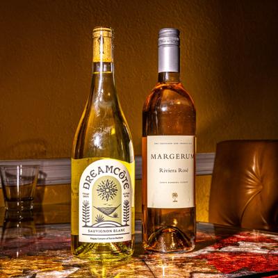 Two bottles of wine displayed on the table.