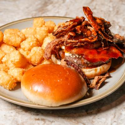 Sidetrack Whiskey Burger served with tater tots.