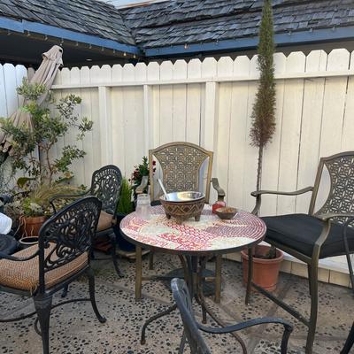 Tables and chairs outside on the patio.