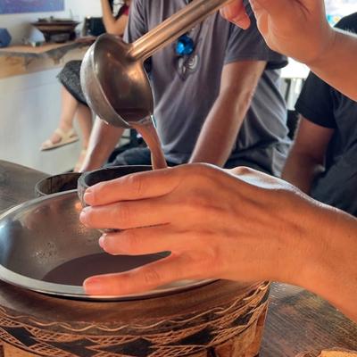 Pouring kava into a cup.