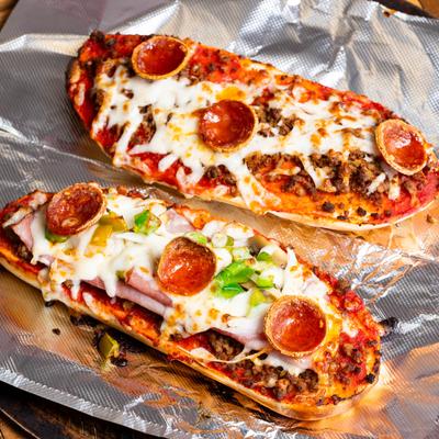 Stromboli, with tomato sauce, sausage, pepperoni, ham, mushrooms, pepper, and cheese.