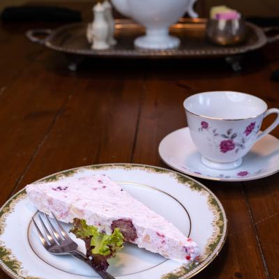 Frozen fruit salad served with tea