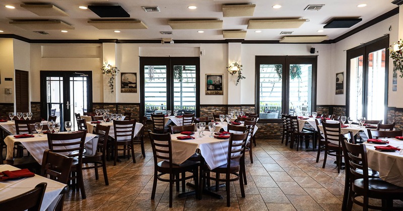 Interior, dining area with tables set for guests