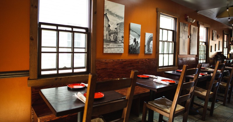 Restaurant interior, tables and seats, wall decor