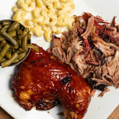 BBQ Chicken served with pulled pork, mac and cheese and green beans.