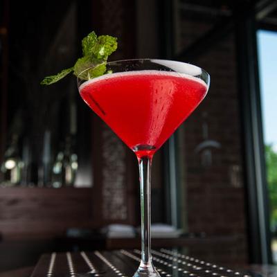 A glass of red cocktail