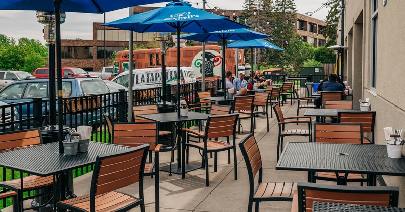 Exterior, patio tables and seating with parasols