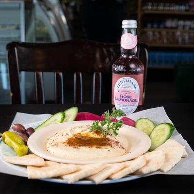 Hummus & Pita accompanied with Rose Lemonade.