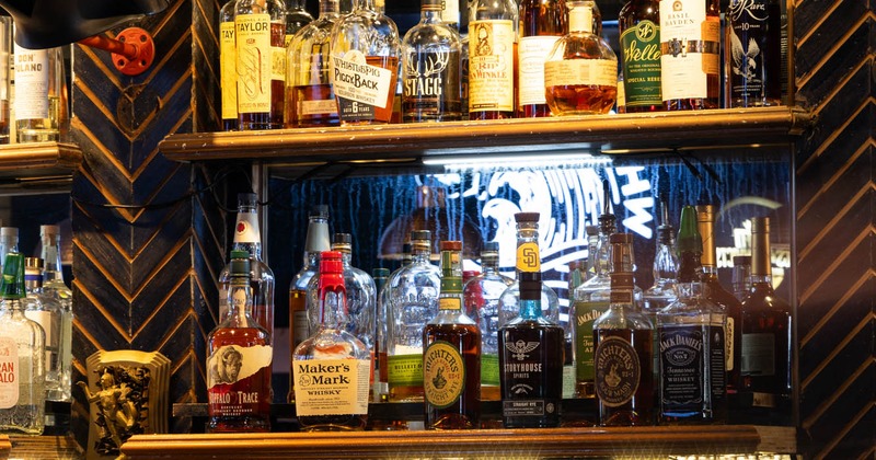 Various liquor bottles on the shelf