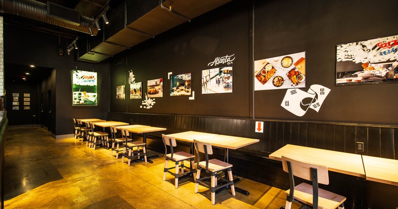 Interior, dining tables and seating by a wall