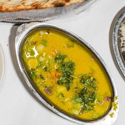 Traditional Indian yellow dal curry with cilantro garnish.
