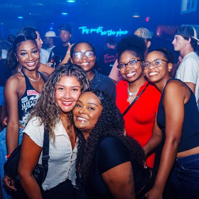 People smiling at the camera and posing.