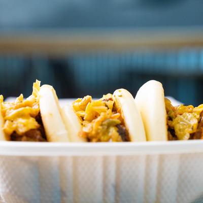 Jerk pork bao buns, closeup.