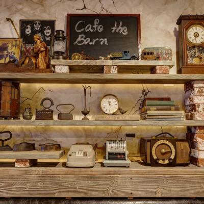 Wooden shelf displaying vintage items.