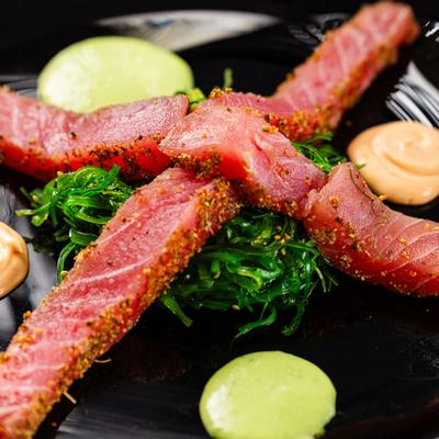 Cajun spice ahi tuna served with seaweed salad and spicy mayo.