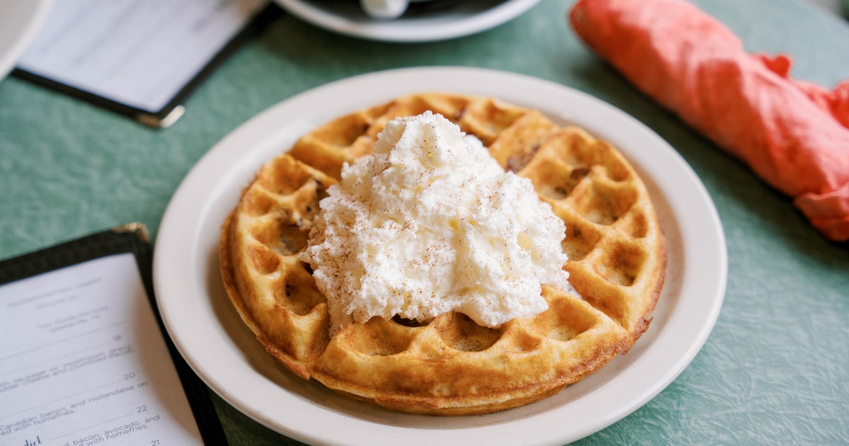 Waffle toped with whipped cream