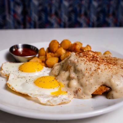 Biscuits and Gravy, fried eggs, and potatoes.