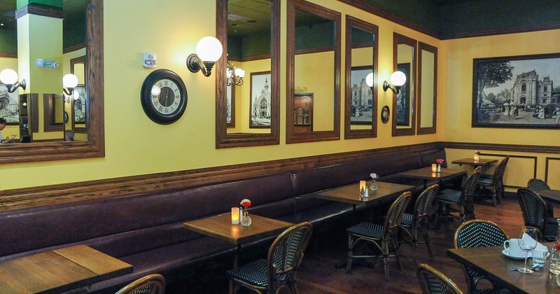 Interior, long wall bench seating, lined up tables and chairs