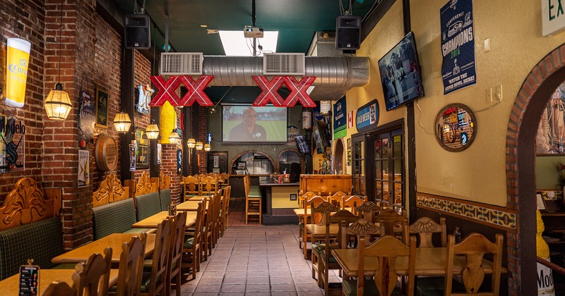 Restaurant interior, dining area with lined up dining tables