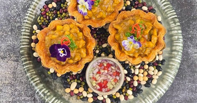 Savory tartlets topped with various garnishes