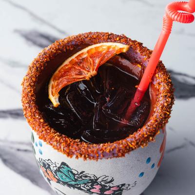 Served cocktail with straw.