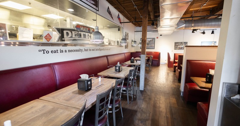 Interior of a restaurant with red booths