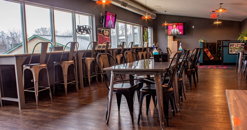 Interior, seating area, bar stools in front of window