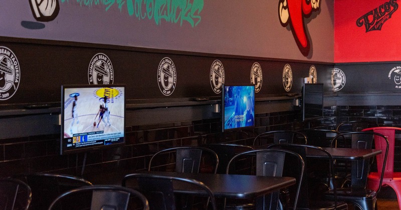 Interior seating area with metal chairs and tables