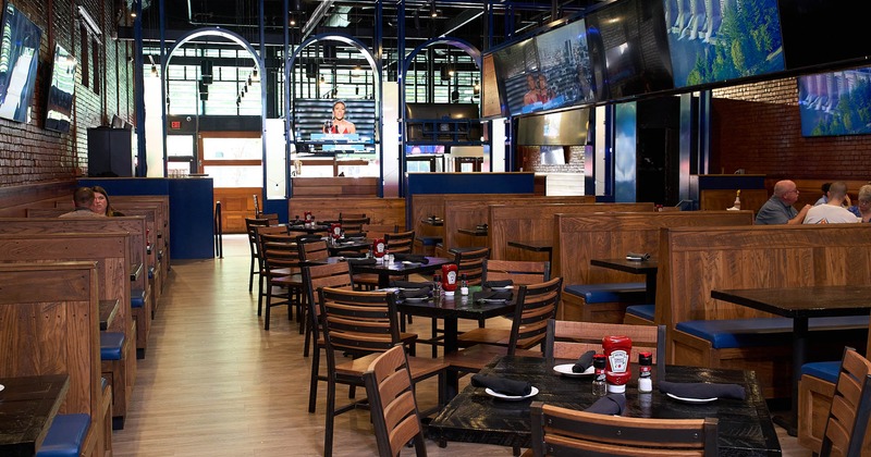 Interior dining area with booths and TVs