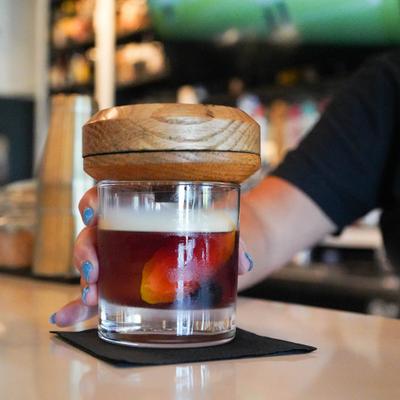 Bartender making an Old Fashioned cocktail.