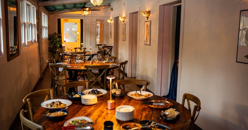 Interior, round tables with chairs ready for guests