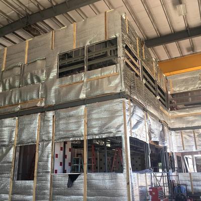 A building interior is being built with a large amount of aluminum sheeting