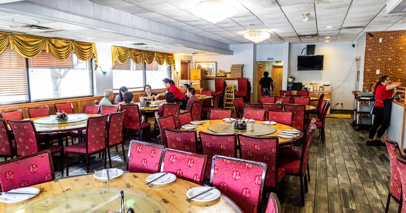 Spacious and cozy interior dining area with set tables
