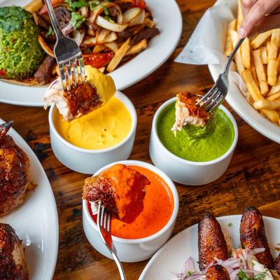 Various served meals and food being dipped.