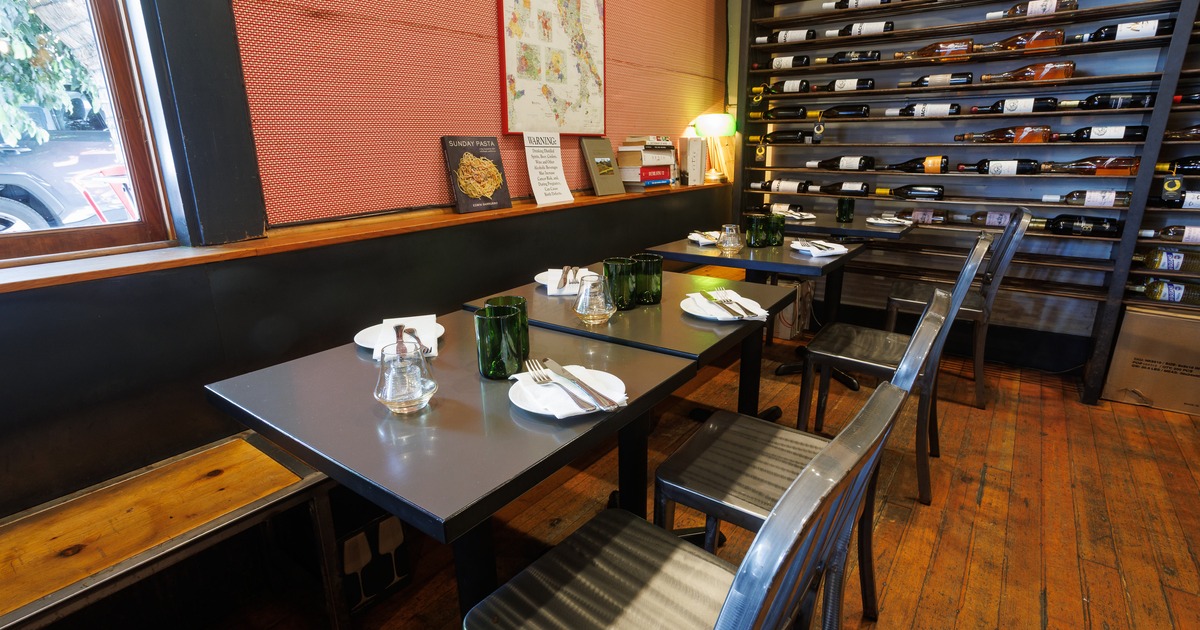 Diner table in front wine rack