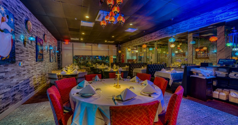 Interior divided by glass, atmospheric lights, tables and chairs