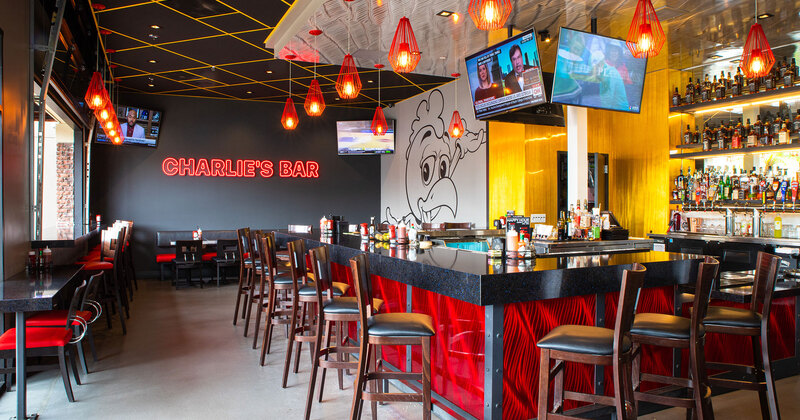 Charlie's Bar with TVs and Open Garage Door