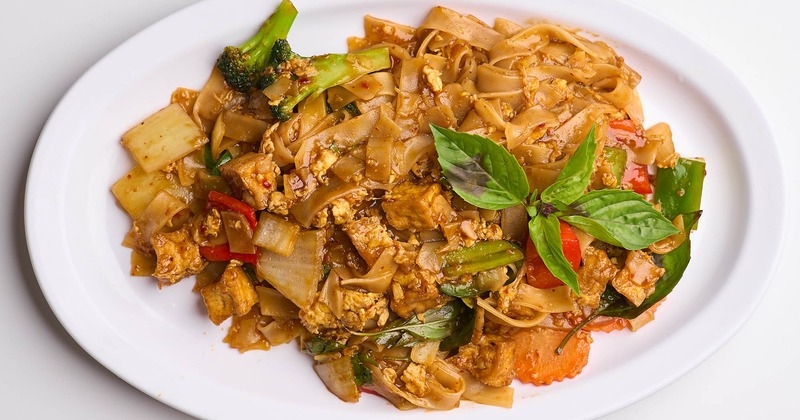 Stir fried noodles, with broccoli, carrots, bell peppers, carrots, eggs, and Thai basil