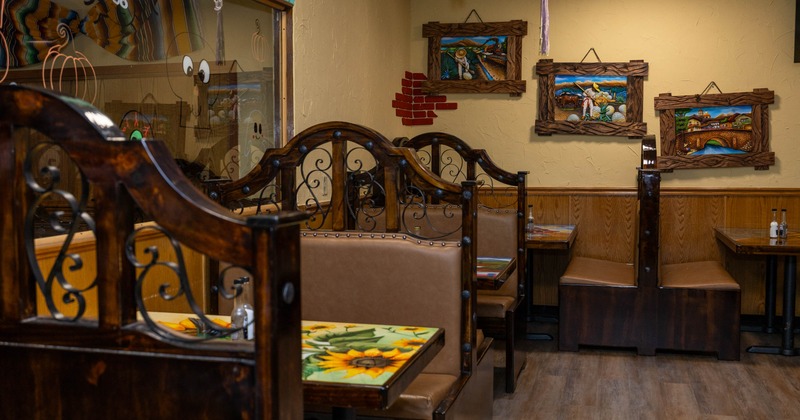 Restaurant interior with ornate wooden booths