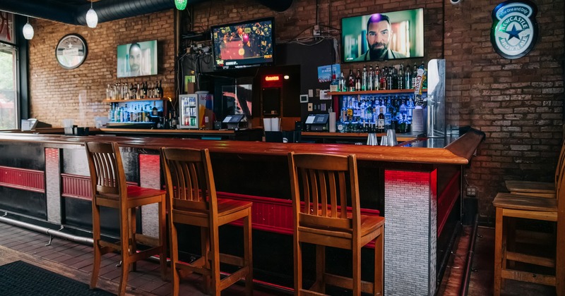 Bar, chairs, tv's above