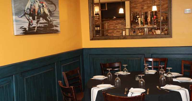 Interior, round table for diner, decoration on the wall
