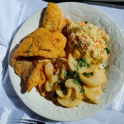 Fried whiting fillet with fries and coleslaw.