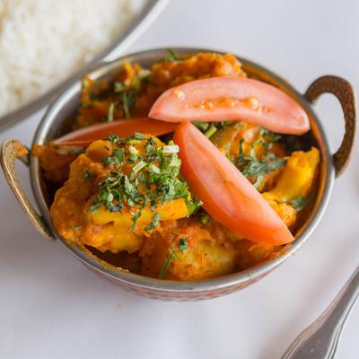 Cauliflower and potatoes cooked with herbs and spices.